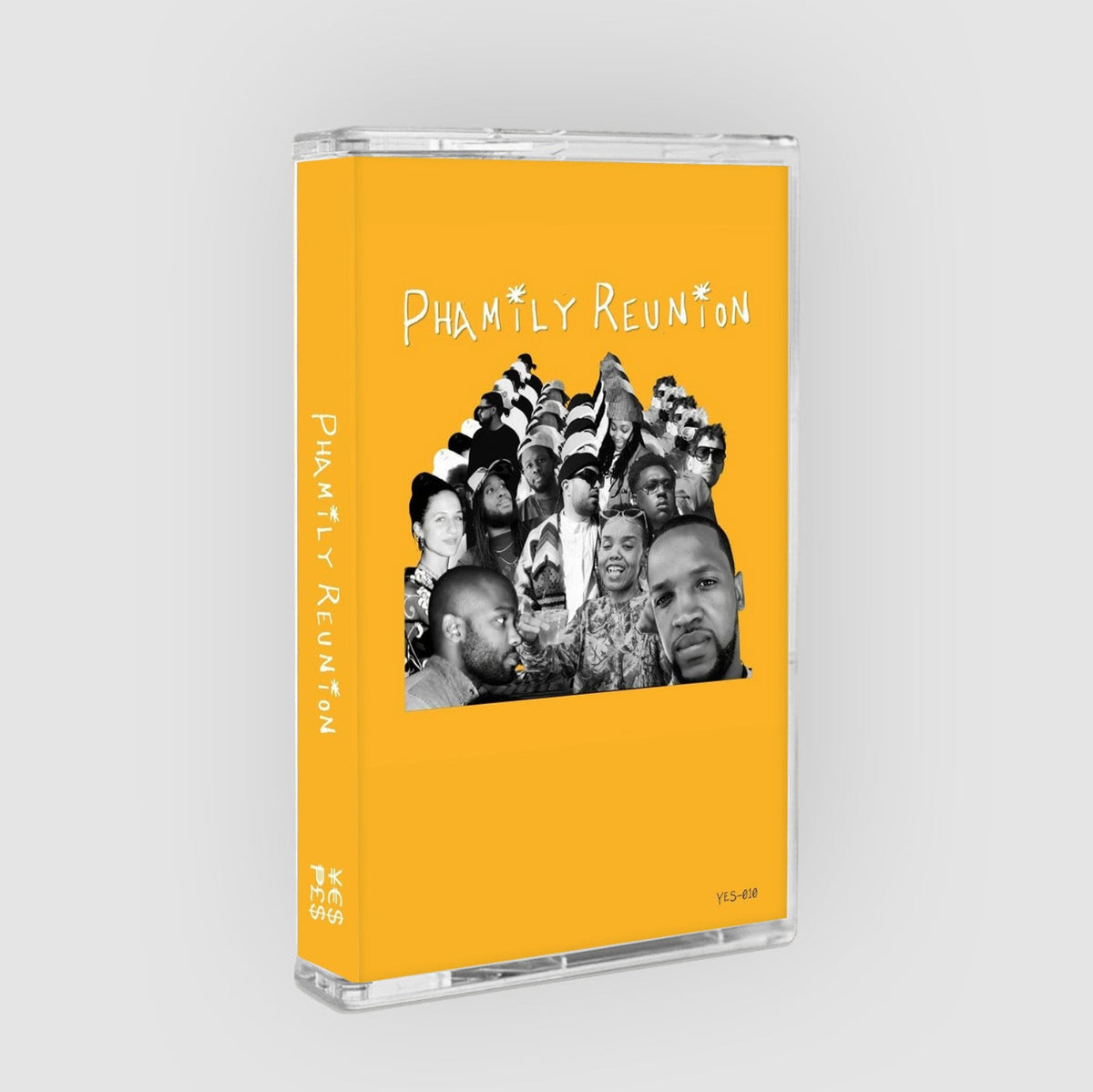 A cassette-style music album case standing upright on a light gray background. The case has a bright yellow-orange cover with the text 'PHMTLY REUNION' and a black-and-white collage photo on the front.